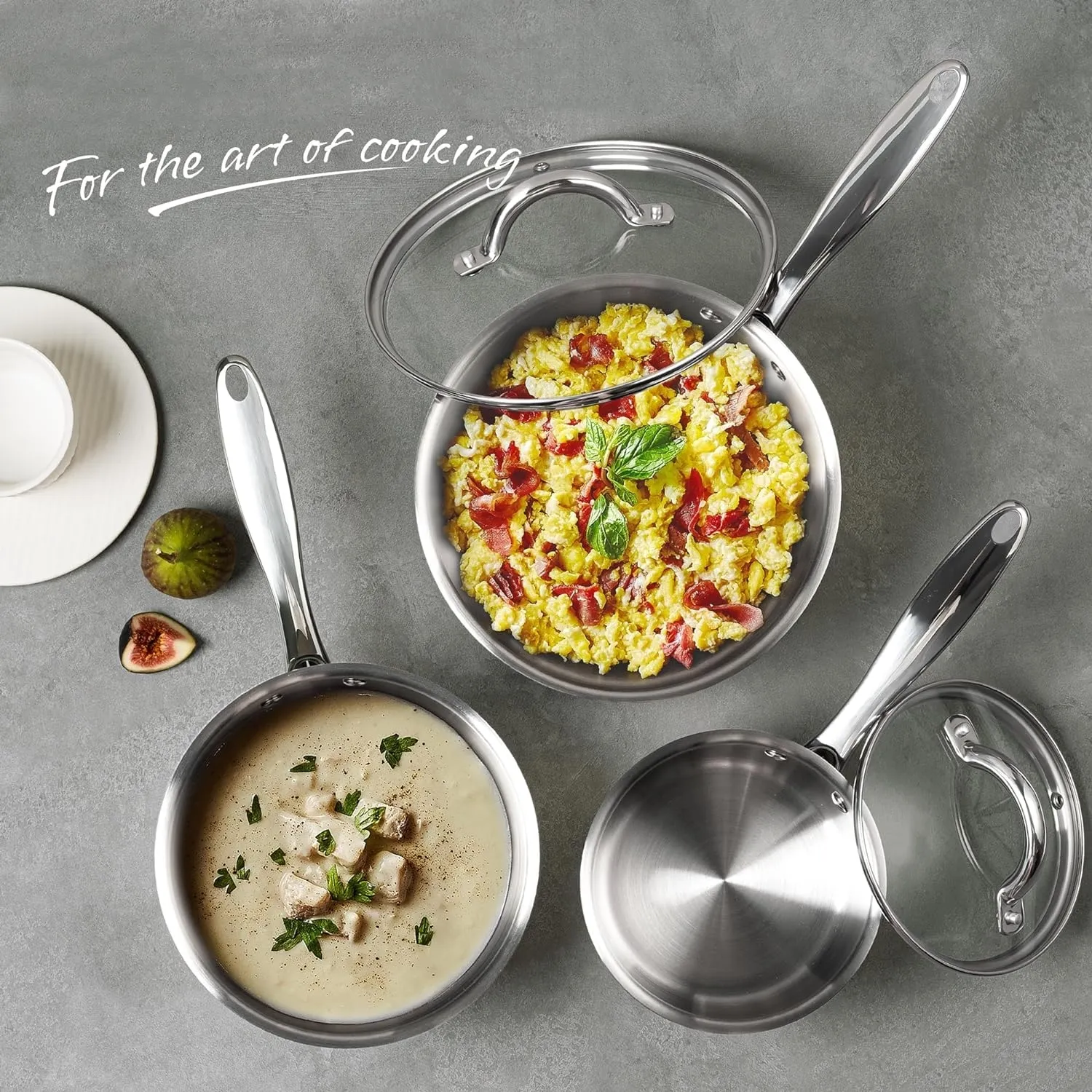 Stainless steel cookware with glass lids and prepared dishes