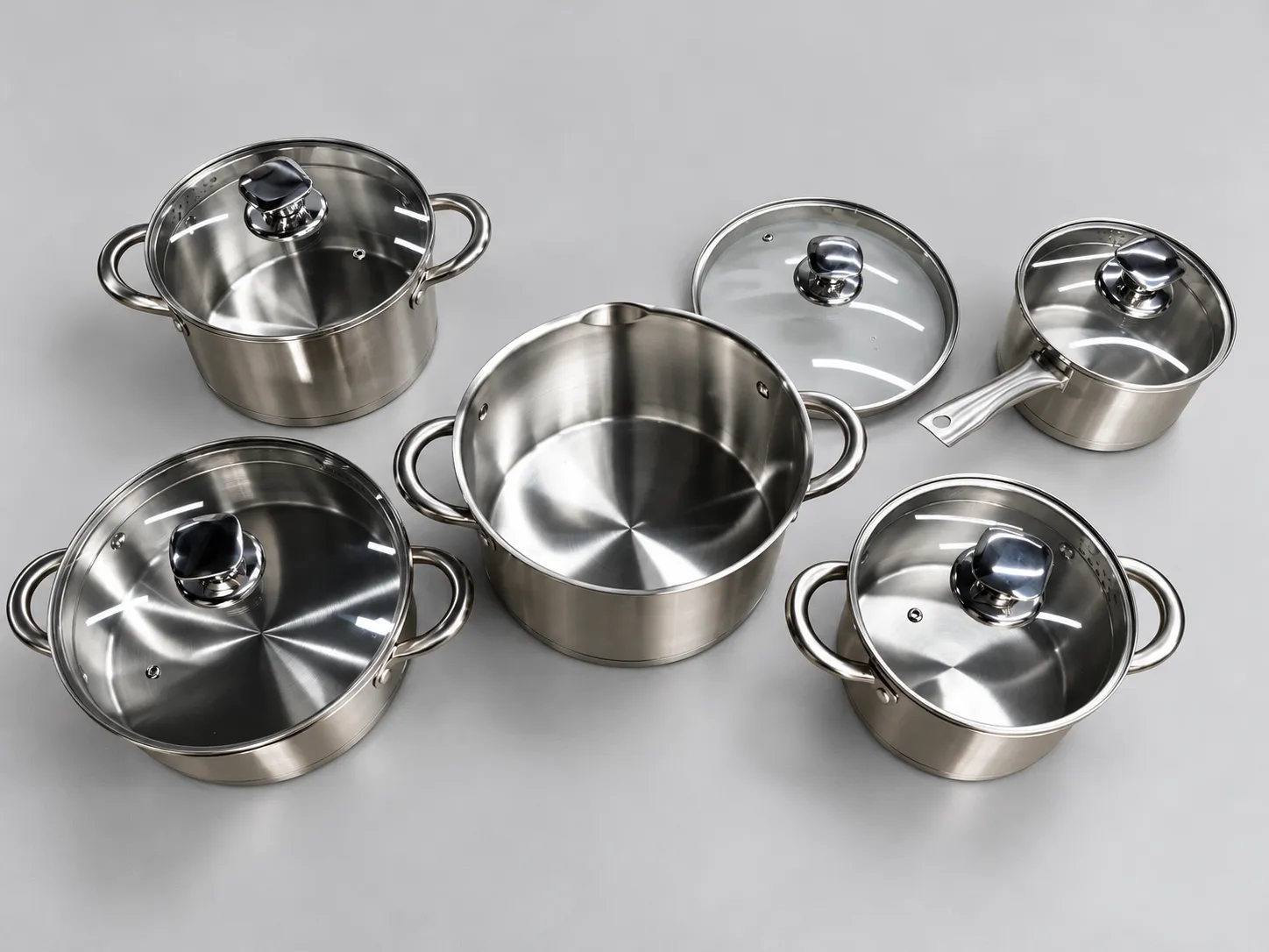 Stainless steel cookware set with glass lids